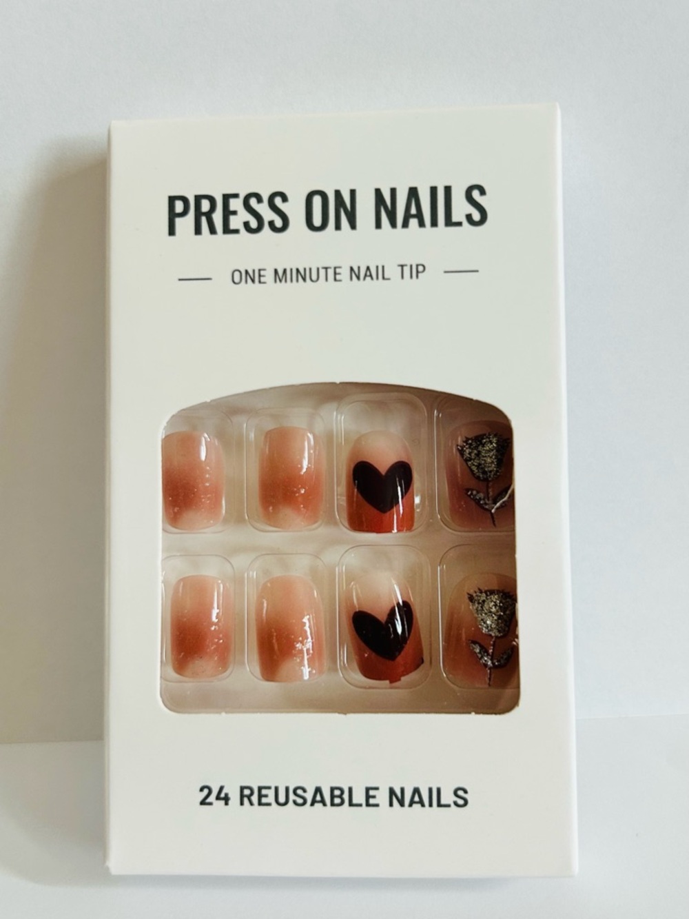 Neutral Peach Press-On Nails with Black Heart & Glitter Leaf Accent